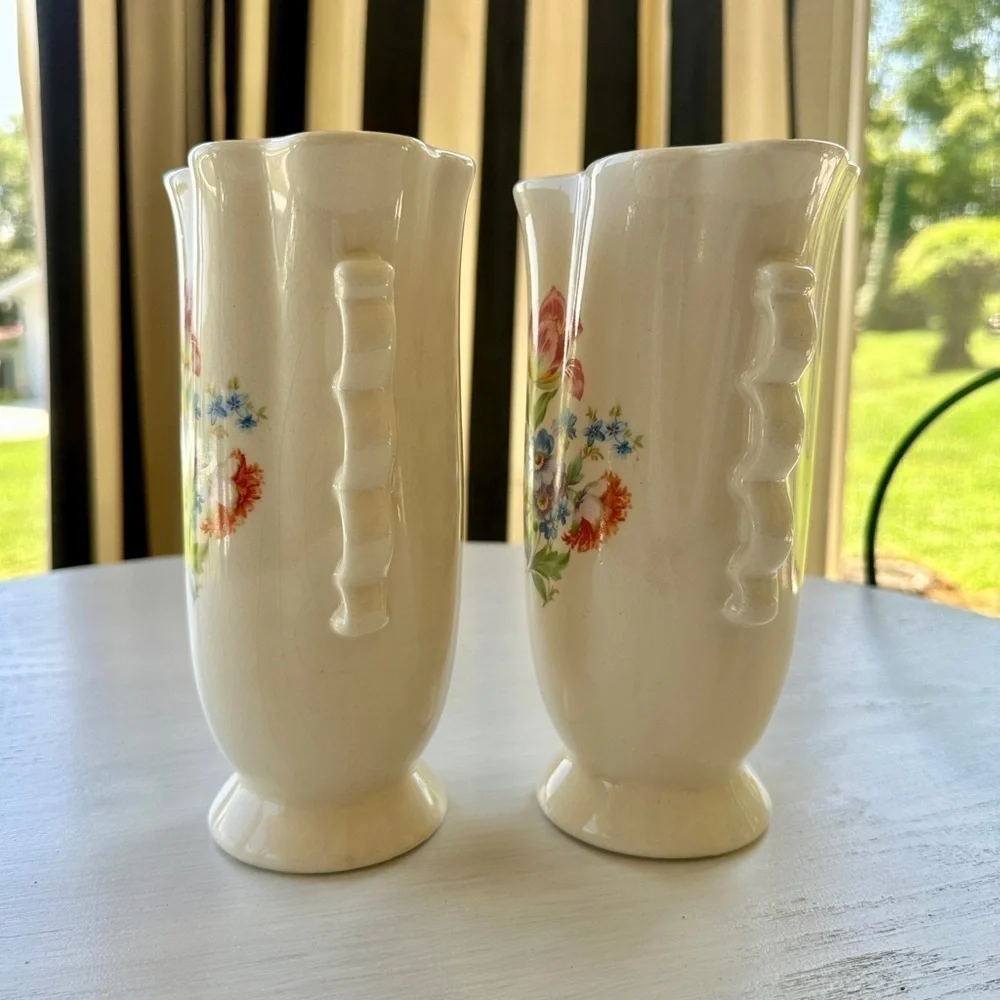 1950’S SET/2 , FLORAL VASES. SOFT CREAM COLOR WITH ONE SIDED FLORAL DESIGN.
